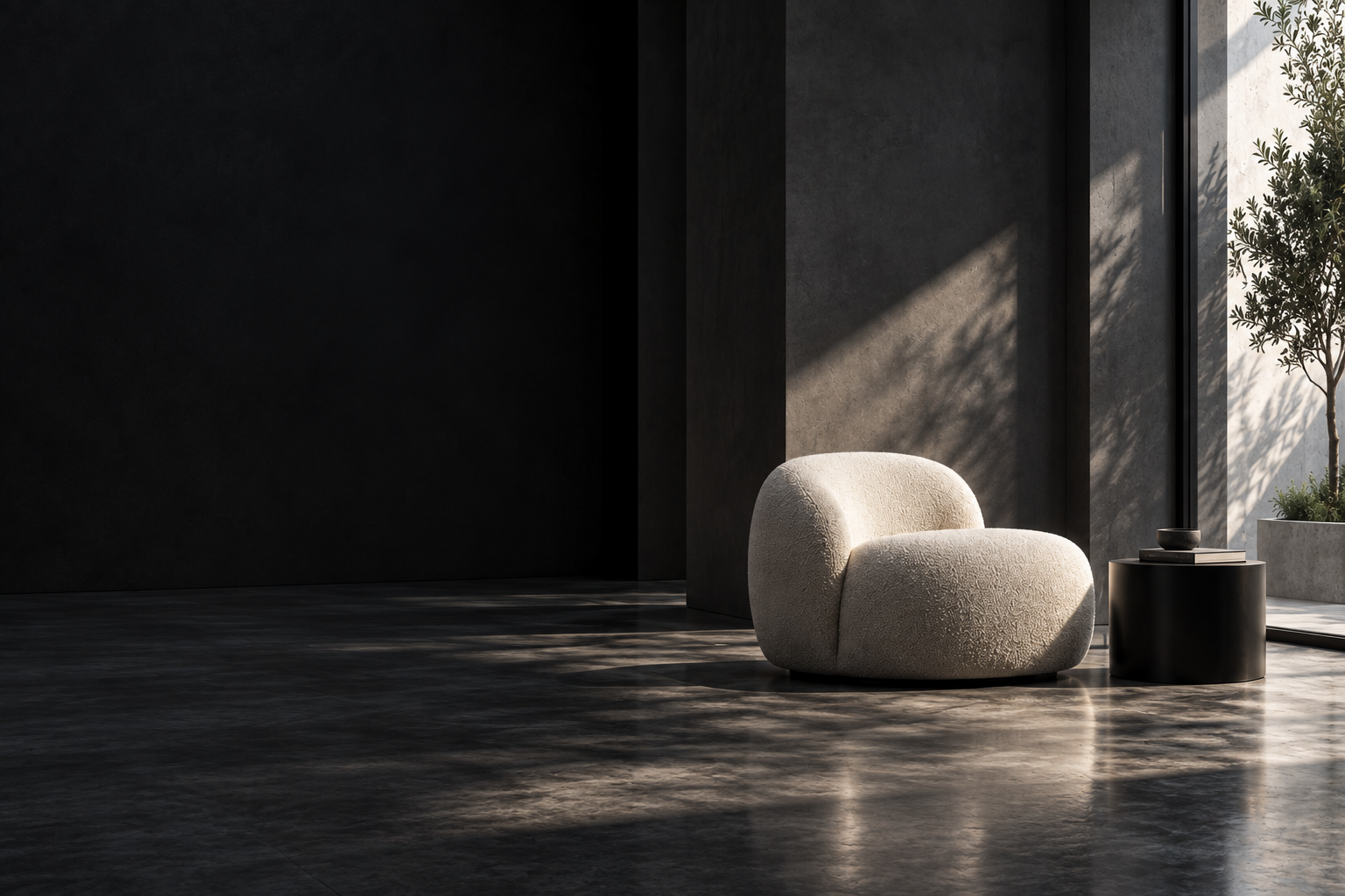 Cream lounge chair in a dark architectural interior